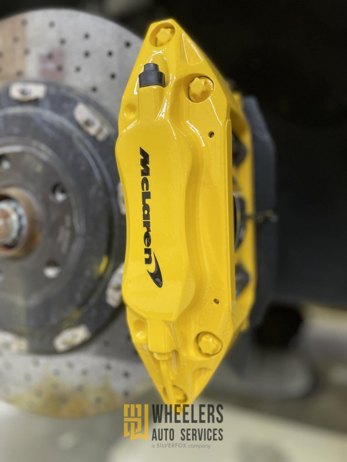 Yellow brake caliper of the car
